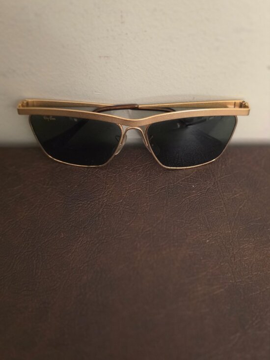 The Vintage Ray-Ban Sunglasses feature a classic gold metal frame with Olympian main image 2